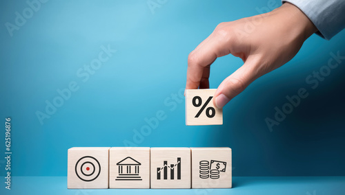 Photography Dividend and Interest Rate Concept: Businessman holding block with  percentage symbol