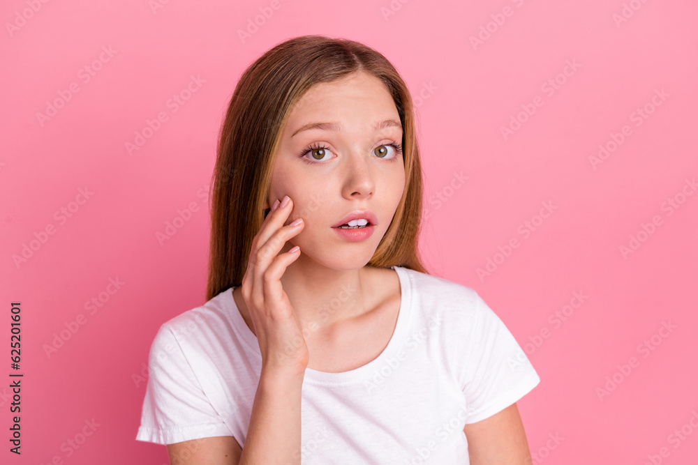 Photo of unsatisfied girl hand fingers touch cheek skin pimples empty space advert isolated on pink color background Photo of unsatisfied girl hand fingers touch cheek skin pimples empty space advert isolated on pink color background