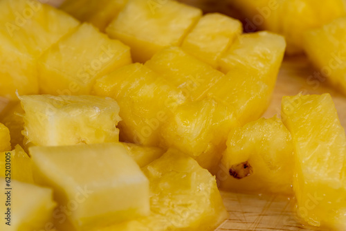 Sliced into pieces of fresh ripe peeled pineapple