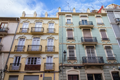 Old colonial buildings at the city of Valencia, Spain, yellow and blue facade © AventuraSur