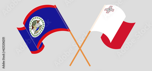 Crossed and waving flags of Belize and Malta