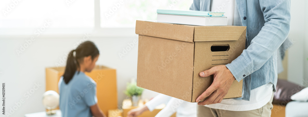 People relocation move home concept, Man carrying belongings box moving in new apartment. People relocation move home concept, Man carrying belongings box moving in new apartment.