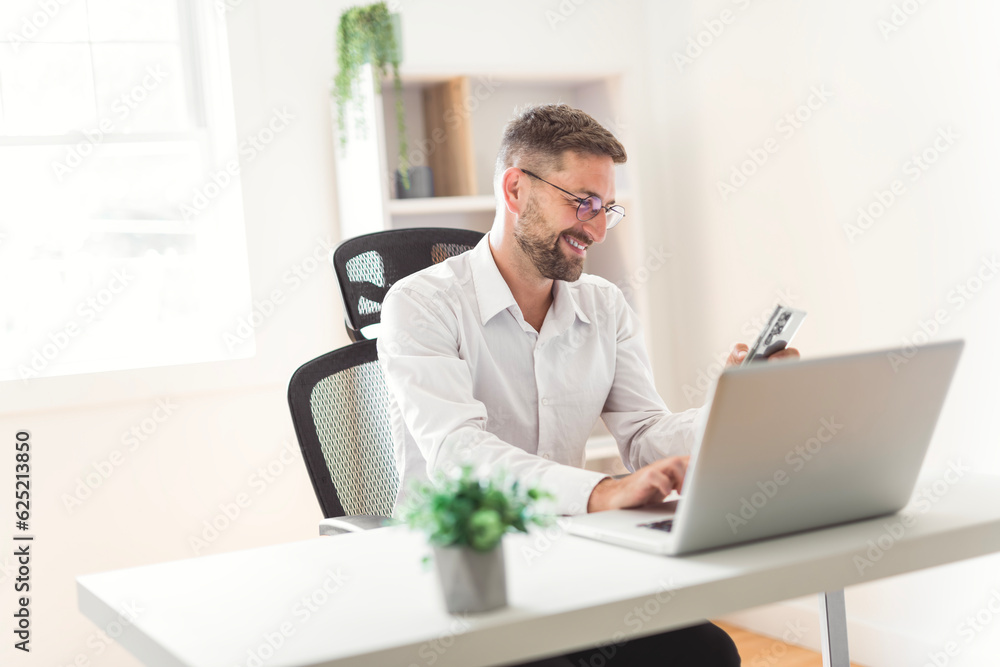 Mature business man using laptop computer in office. Mature business man using laptop computer in office.