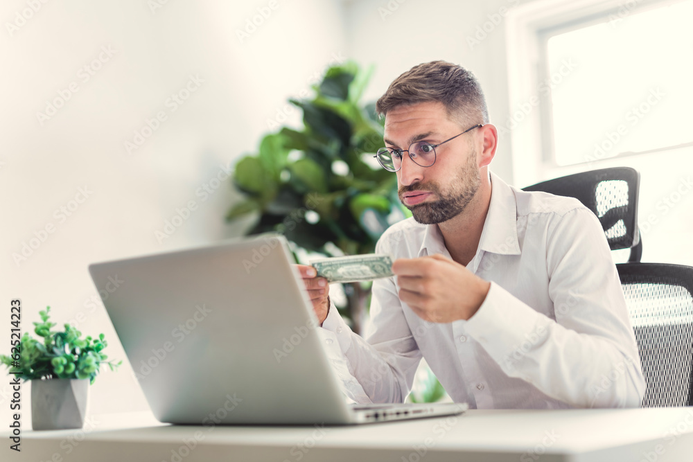 Mature business man using laptop computer in office. Mature business man using laptop computer in office.