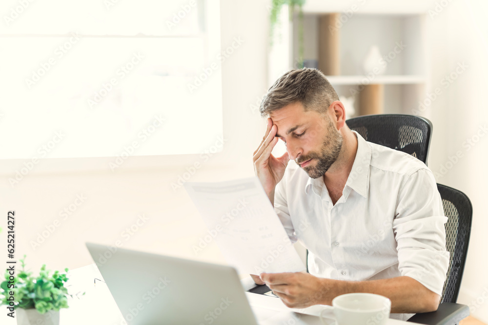 Mature business man using laptop computer in office. Mature business man using laptop computer in office.