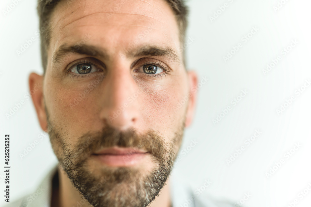 Close-up daylight portrait of young smiling handsome man isolated on gray background Close-up daylight portrait of young smiling handsome man isolated on gray background