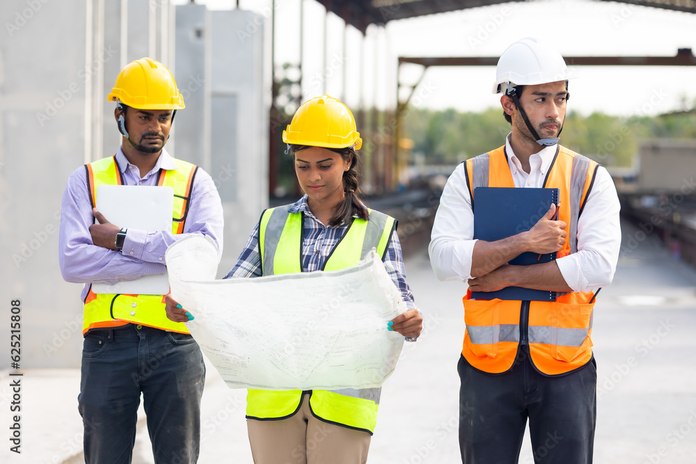 Group portrait. Professional Mechanical Engineer team Working on construction blueprints paper at Prefabricated concrete factory Heavy industrial. Product quality Inspection. Unity and teamwork Group portrait. Professional Mechanical Engineer team Working on construction blueprints paper at Prefabricated concrete factory Heavy industrial. Product quality Inspection. Unity and teamwork