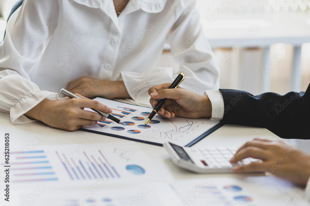 Businesswoman meeting financial advisor discuss business growth chart analysis in financial report and planning investment strategy. Businesswoman meeting financial advisor discuss business growth chart analysis in financial report and planning investment strategy.