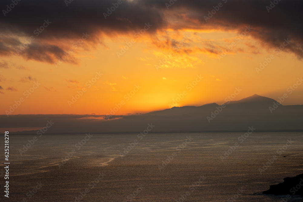 Spectacular sunset from Puerto Rico, Gran Canaria, with Teide as a witness, Tenerife, Spain