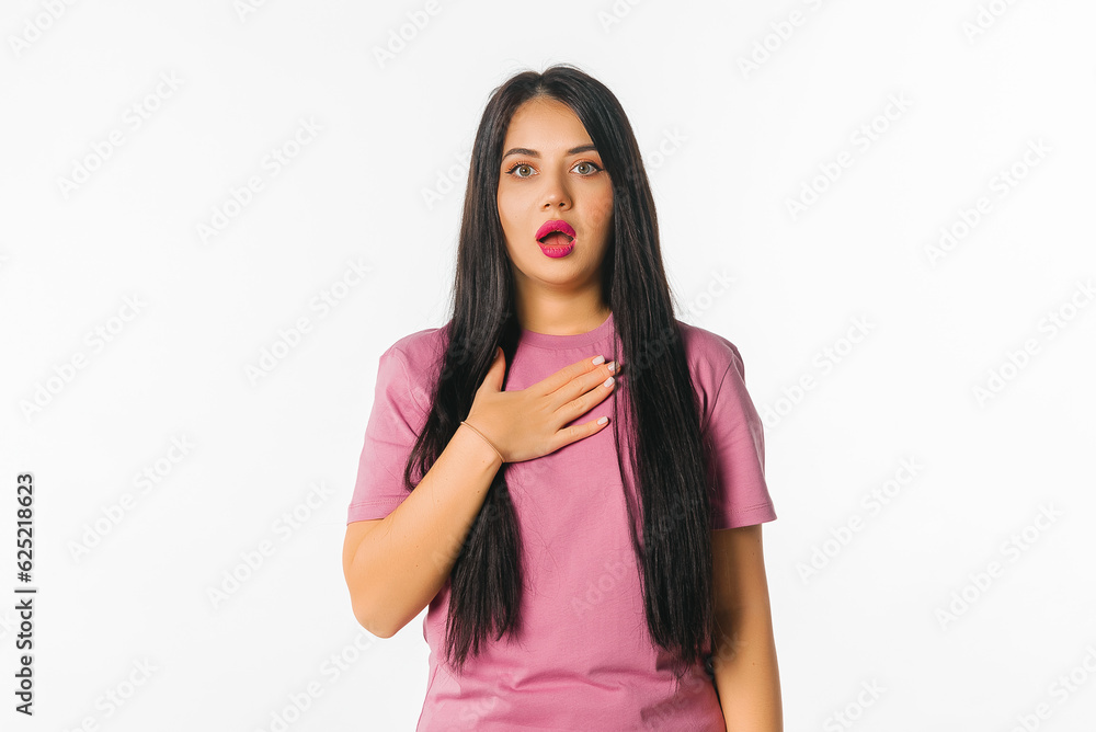 Oh my God. Amazed young woman in trendy magenta t shirt staring at camera with opened eyes and mouth not believing their eyes what she see. Emotional people Oh my God. Amazed young woman in trendy magenta t shirt staring at camera with opened eyes and mouth not believing their eyes what she see. Emotional people