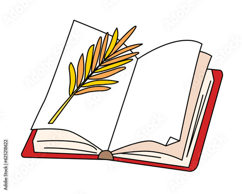 Open book with dried plant between pages