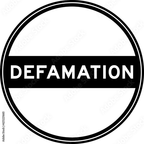 Black color round seal sticker in word defamation on white background