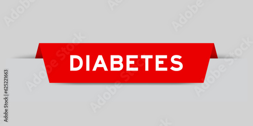 Red color inserted label with word diabetes on gray background