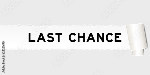 Ripped gray paper background that have word last chance under torn part