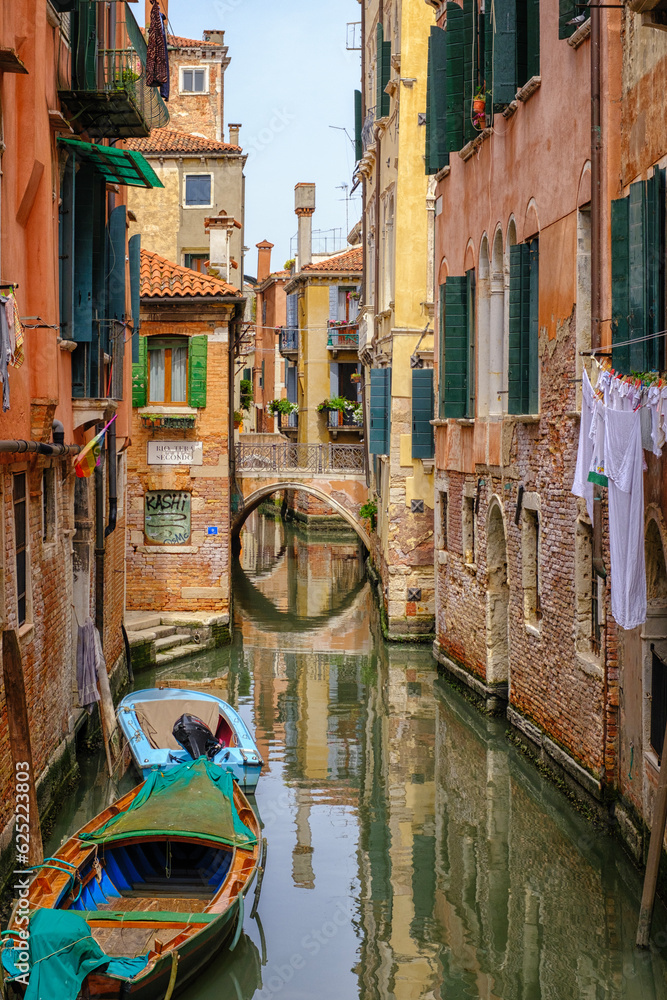 Venice, Italy - June 22, 2023: Canal, bridge and ancient houses of Venice