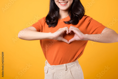 Slika na platnu healthcare, wellness, and well-being with young Asian woman 30s wearing an orange shirt