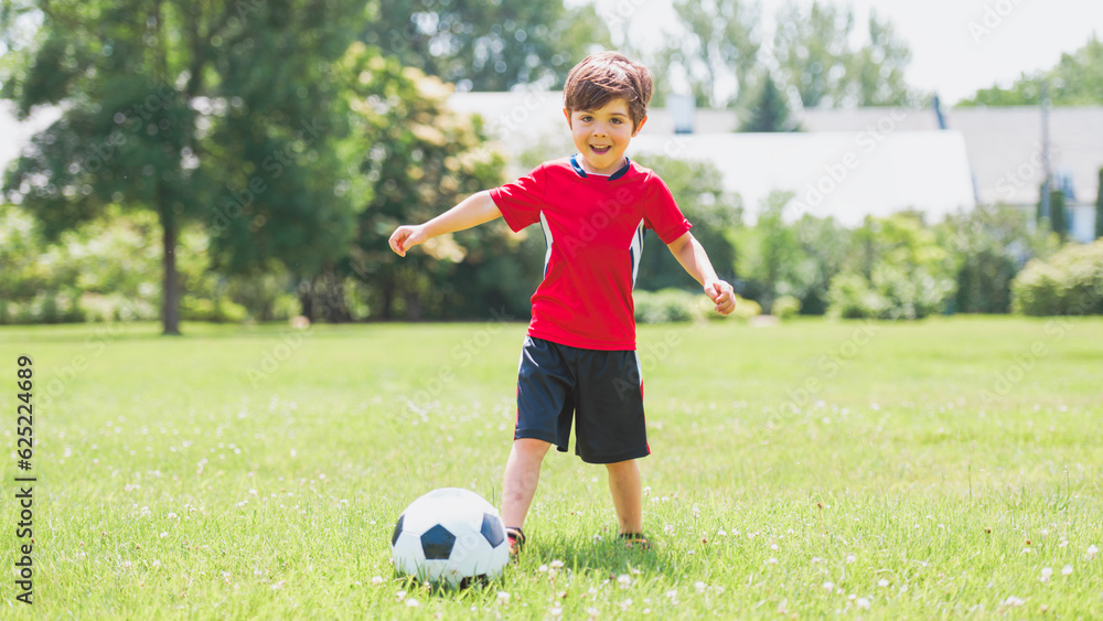 Young soccer player having fun on a field with ball Young soccer player having fun on a field with ball