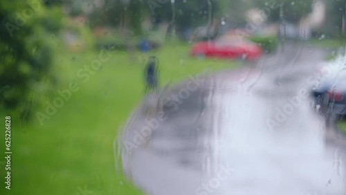 rainy day in ireland in housing estate while rain falls on windows photo