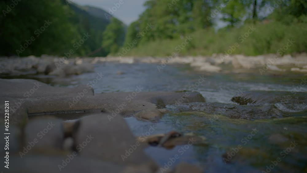 River water flow stream of water outdoors in riverbed River water flow stream of water outdoors in riverbed