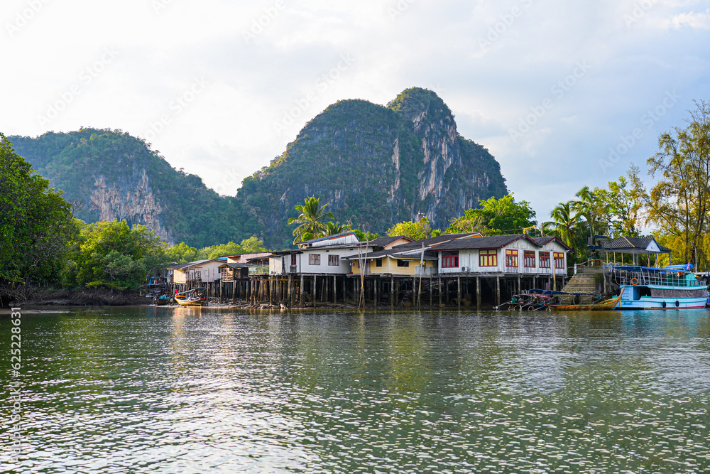 Traditional fishermen village with stilt houses in the Bay of Phang Nga in the Andaman Sea in Thailand, Southeast Asia Traditional fishermen village with stilt houses in the Bay of Phang Nga in the Andaman Sea in Thailand, Southeast Asia