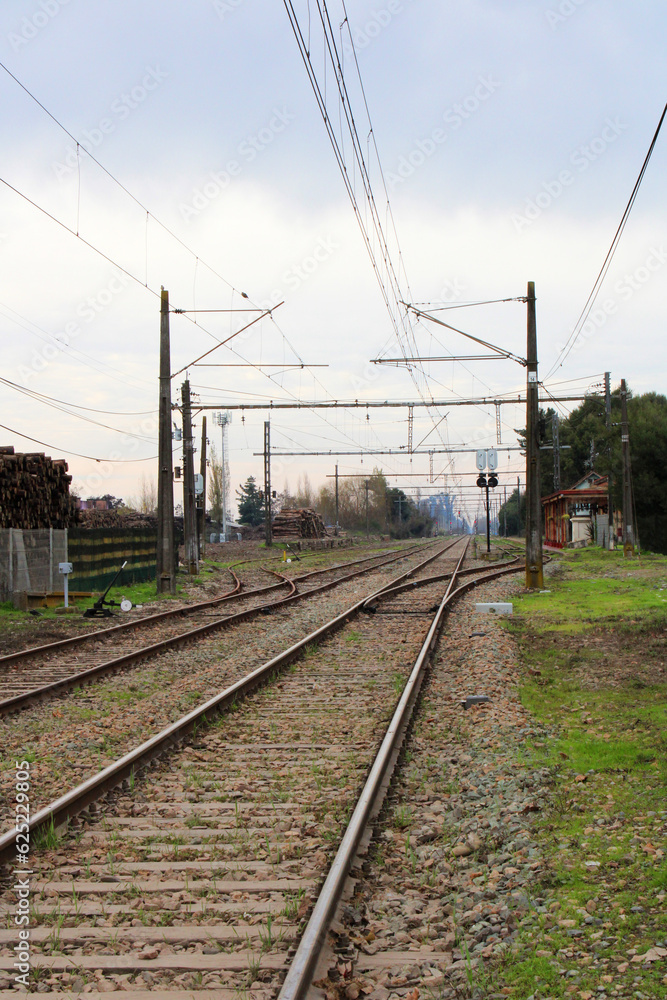 Rural landscape with railway line and old station in Molina, Maule Region, Chile