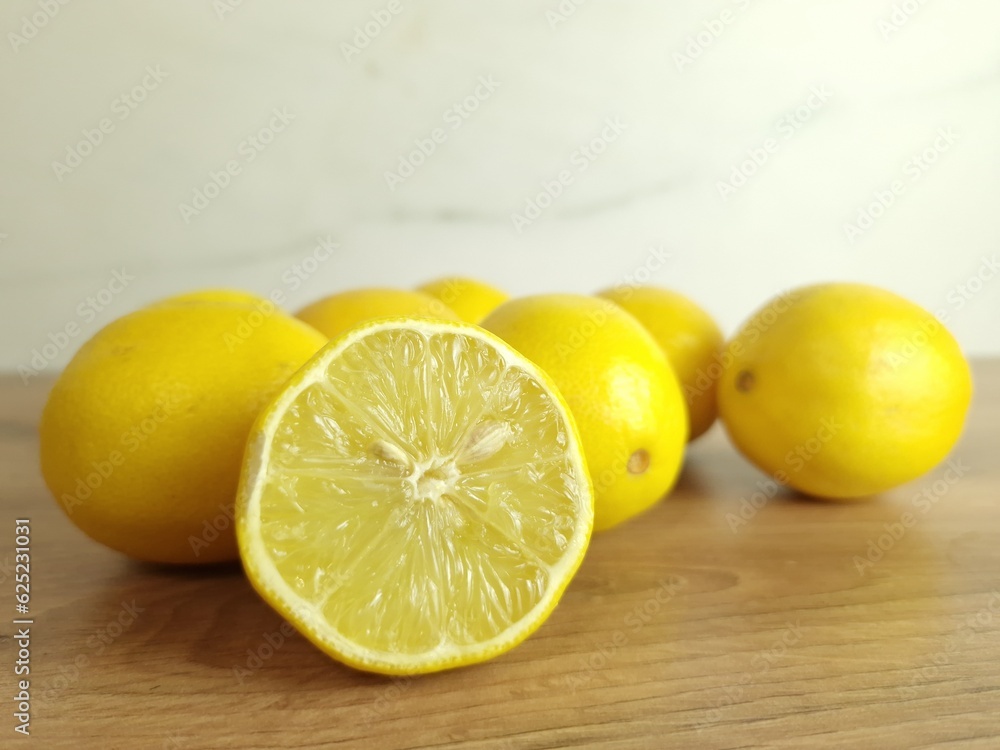 Fresh lemons on wooden table Fresh lemons on wooden table