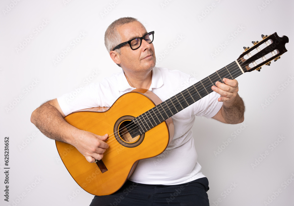 Adult man playing guitar isolated on white background