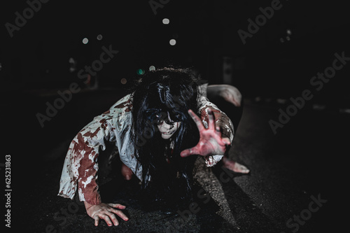 Horror woman concept,Ghost on the road in the city,A vengeful spirit on the street of the town,Halloween festival,Make up ghost face photo