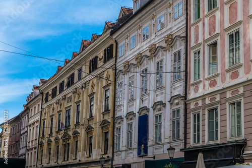 A view of decorative building facades in a street below the castle above Ljubljana, Slovenia in summertime