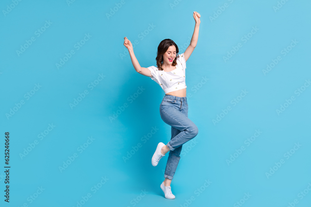 Full length photo of lucky excited lady wear white blouse rising fists screaming isolated blue color background