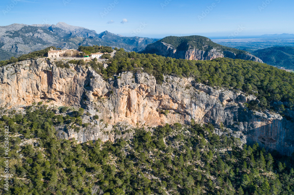 Castle of Alaró (Mallorca). Ruins of a medieval castle on the summit of a mountain in the Serra de Tramuntana on the island of Mallorca, where there is now a mountain refuge. Balearic Islands, Spain. Castle of Alaró (Mallorca). Ruins of a medieval castle on the summit of a mountain in the Serra de Tramuntana on the island of Mallorca, where there is now a mountain refuge. Balearic Islands, Spain.