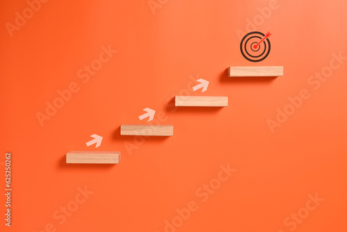 Fotografia Correct checklist and target goal icons on wooden blocks, Business strategy plan