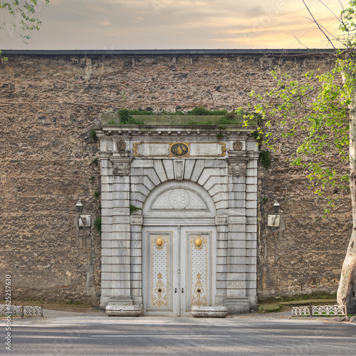 Closed Valide Gate, or Valide Kapisi of former Ottoman Dolmabahce Palace, or Dolmabahce Sarayi, suited in Ciragan Street, Besiktas district, Istanbul, Turkey photo