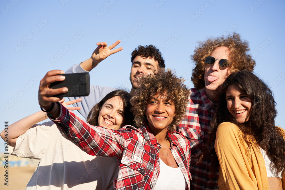Fototapeta premium Multiracial group of young people taking selfie. Concept of friendship.