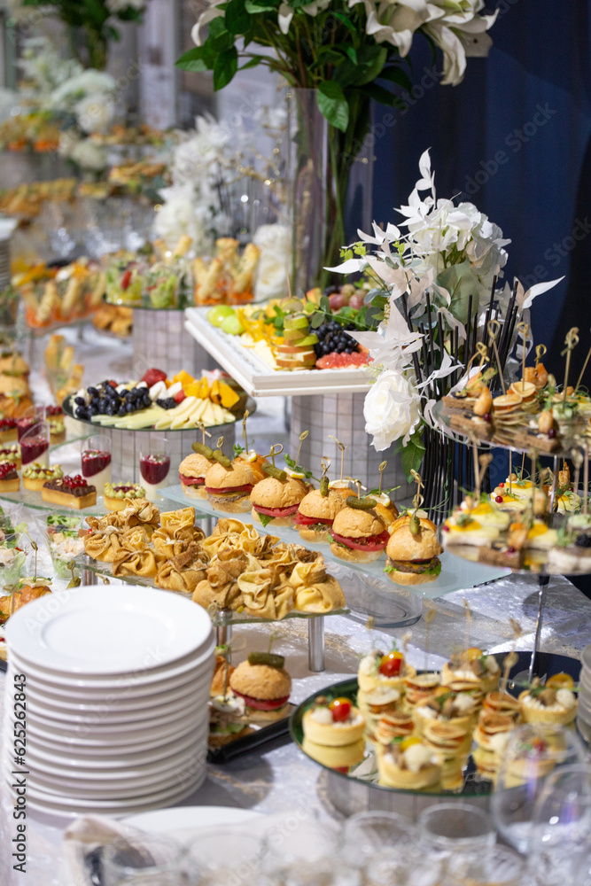 various snacks and drinks at the buffet table at the corporate catering event
