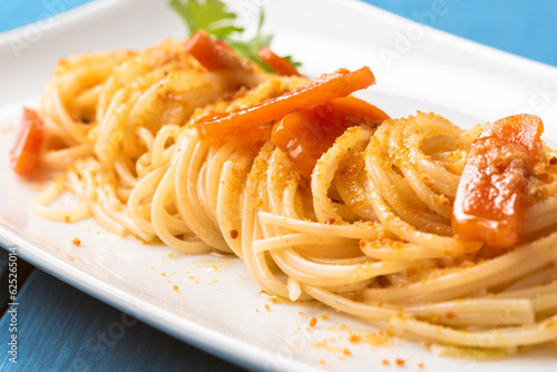 Deliziosi spaghetti con bottarga di muggine, cucina Sarda, cibo italiano  photo