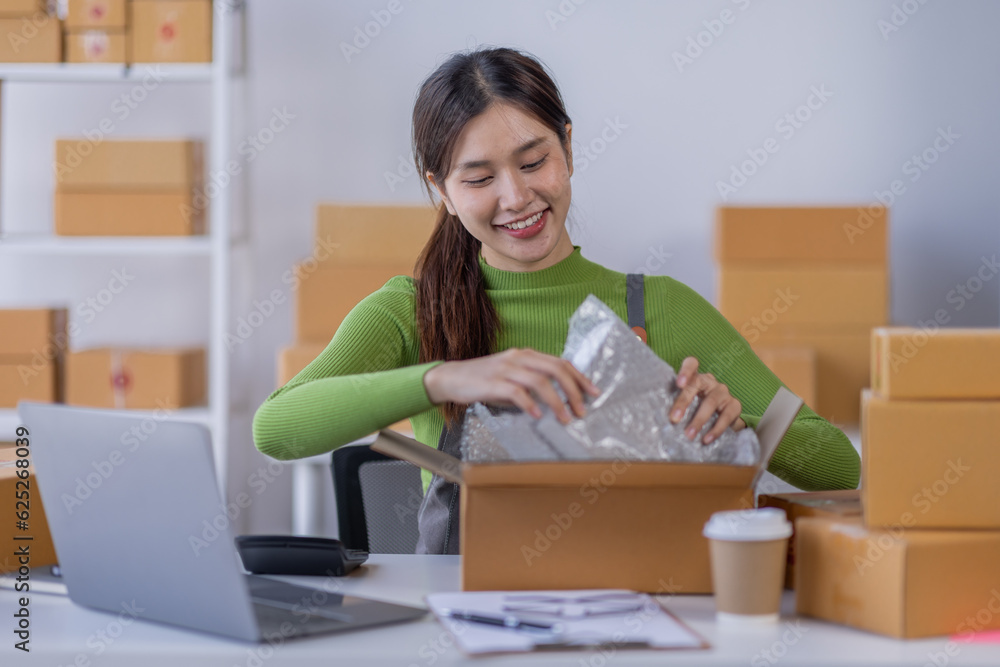 Startup happy Asian woman business owner works with a box at home, prepare parcel delivery SME supply chain, procurement, package box to deliver to customers, Online SME business entrepreneurs ideas,
Startup happy Asian woman business owner works with a box at home, prepare parcel delivery SME supply chain, procurement, package box to deliver to customers, Online SME business entrepreneurs ideas,