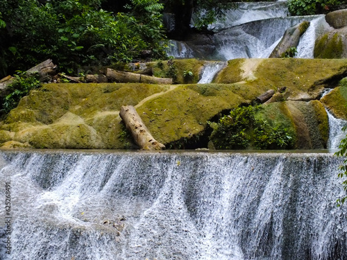 The scenery of Moramo Waterfall, Southeast Sulawesi, one of the terraced waterfalls in Indonesia photo