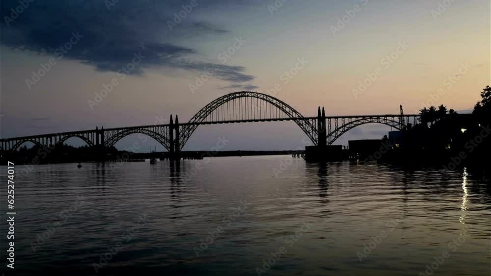 Bridge Silhouette: Mesmerizing Time-Lapse of Newport Bridge at Sunset, Painting the Sky with Radiant Colors in 4K Resolution Bridge Silhouette: Mesmerizing Time-Lapse of Newport Bridge at Sunset, Painting the Sky with Radiant Colors in 4K Resolution