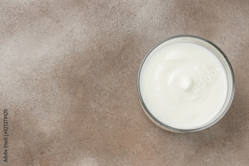Creamy natural yogurt on a light background  Probiotic cold fermented dairy drink. Long banner format. top view
