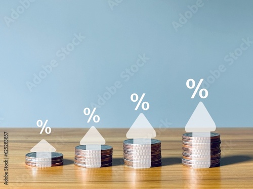 Interest rate and dividend with percentage sign and up arrow Interest rates continue to rise. Long-term investments for retirement.