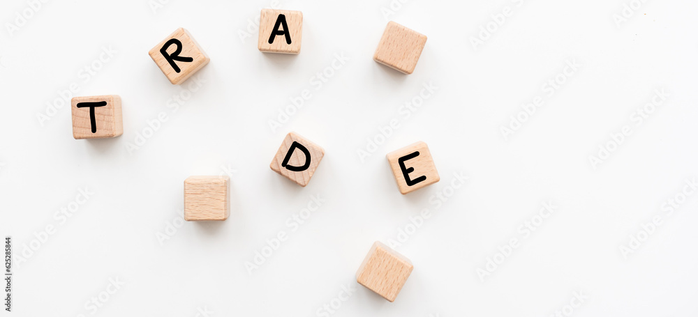 Trade symbol. Wooden cubes with word Trade. Beautiful white background. Trade concept. Copy space.