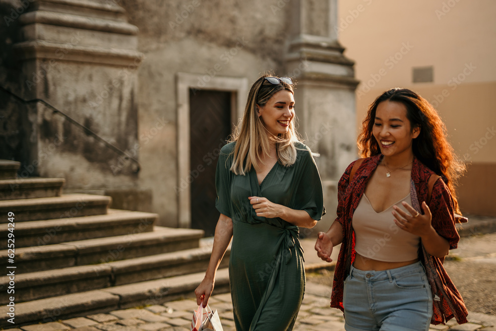 Closeup face of multiethnic friends enjoying outdoor street.