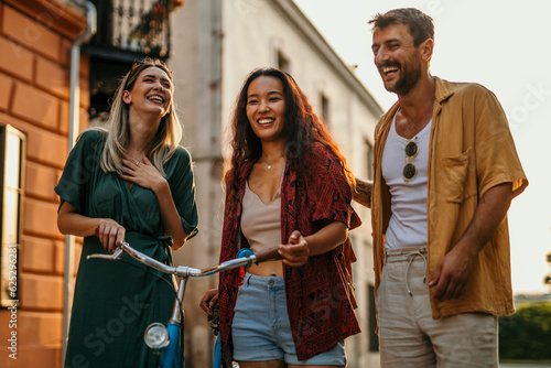 Tourists from around the world, dressed in colorful attire, explore the city's vibrant neighborhoods by bicycle, immersing themselves in its diversity.