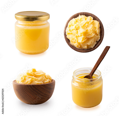 Clarified butter in jar and in wooden bowl, cooking oil, pure ghee isolated on white background. Clarified butter with copy space for text on white. Ghee butter in a bowl from different angles.