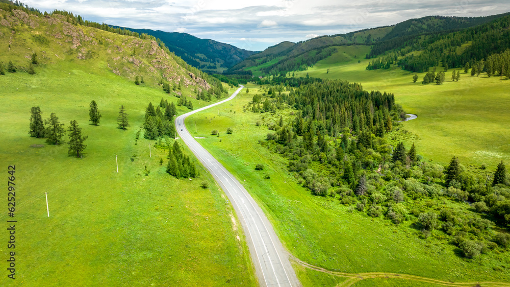 Aerial panorama of Chui tract or Chuya Highway in the Altai mountains. Highway road in mountain valley. Summer landscape. Altai Republic, Shebalinsky district, South Siberia, Russia