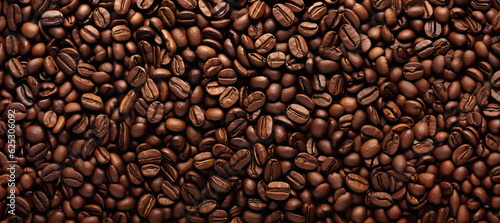 Texture from a lot of roasted coffee beans. Big coffee beans pattern. © Igor