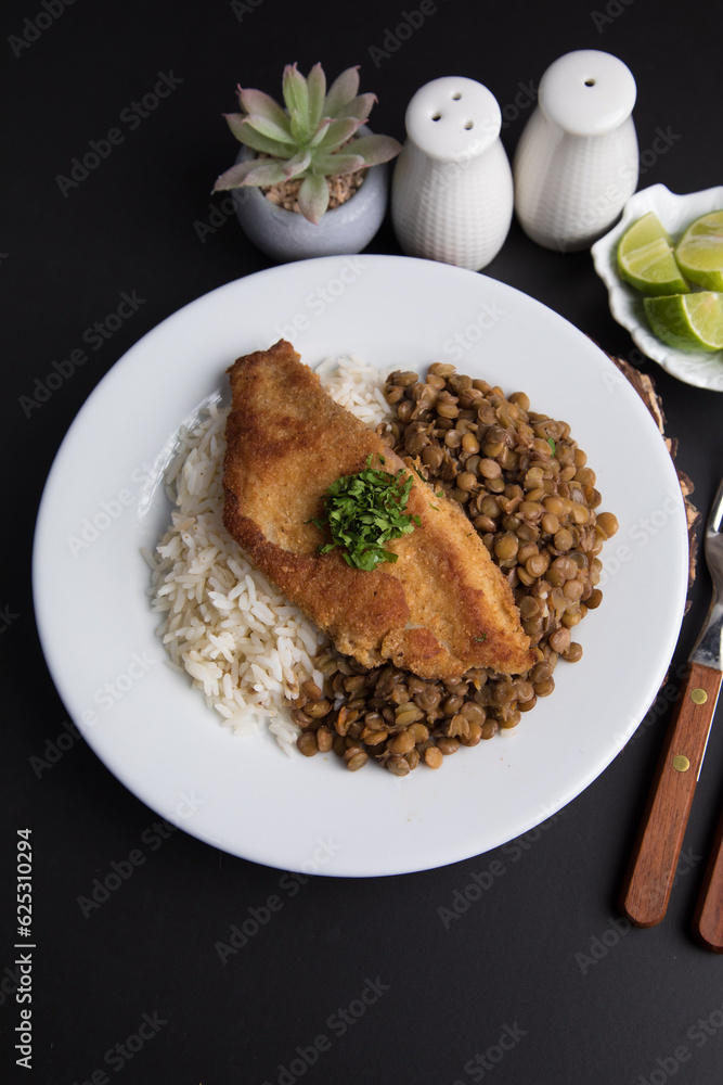 Fried fish fillet with lentils stew Food buffet peruvian table Assorted dishes gourmet cuisine Peru traditional Fried fish fillet with lentils stew Food buffet peruvian table Assorted dishes gourmet cuisine Peru traditional