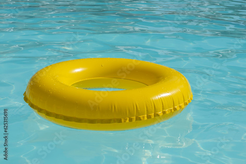 Inflatable ring in clear water. Summer holiday background.