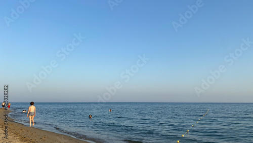  A view from Kefalos (Aydincik) Beach in Gokceada. It is a sandy beach and one of the most popular beach on the island. photo